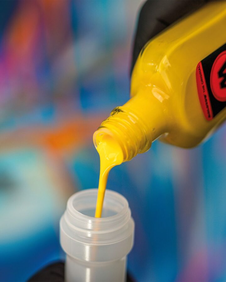 Photo showing a fillable empty Dripstick marker being filled with yellow permanent colour