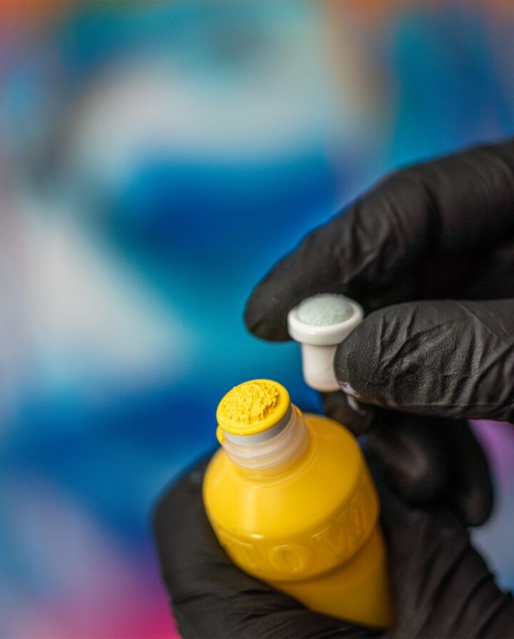 Close-up of a yellow Dripstick with exchange tip